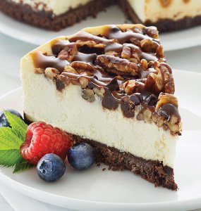 Chocolate Caramel Pecan Cheesecake Topped with Strawberries